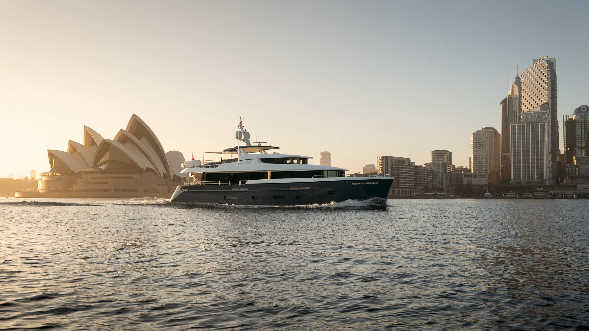 M/Y Belle on Sydney Harbour, the Opera House and the city behind her